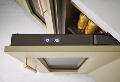 Aerial view of Sub-Zero 15" Designer Undercounter Beverage Center - Panel Ready (DEU1550BG) door with touchscreen panel for settings and temperature control