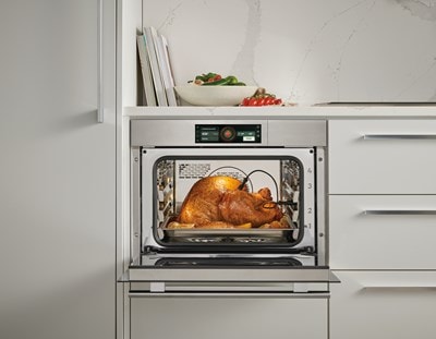 Wolf E Series Transitional Convection Steam Oven (CSOP2450TE/S/T) shown taking all of the guesswork out of cooking thanks to intelligent gourmet cooking modes.