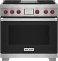 Wolf 36" 4 Burner Dual Fuel Range with Infrared Griddle (DF36450G/BK/P) featuring black accent colored door and signature red Wolf knobs.