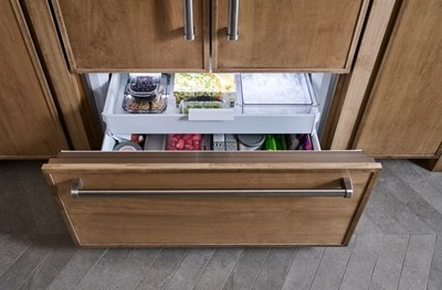 Alt Text: Interior view of the drawer with food items inside the Panel Ready 42" Classic French Door Refrigerator and Freezer.