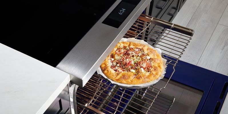 Wolf 36&quot; Induction Range (IR36550/S/T) with Dual VertiFlow™ convection system delivers consistent multi-rack cooking as seen here with a tomato galette.