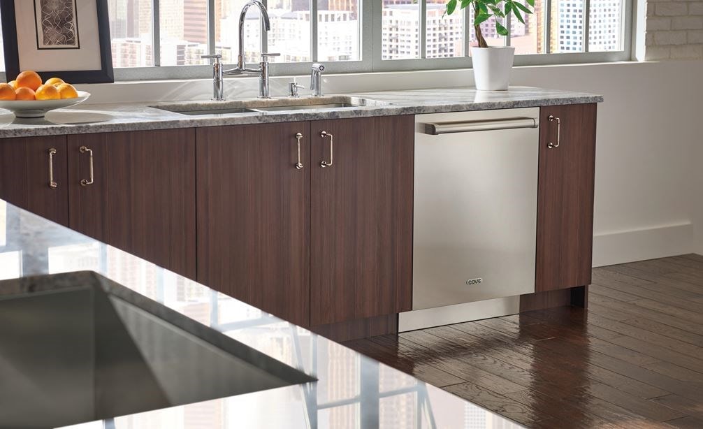 Stainless Steel Cove Dishwasher with Pro Handle (DW2450) installed in Brizo kitchen featuring natural wood tone cabinets.