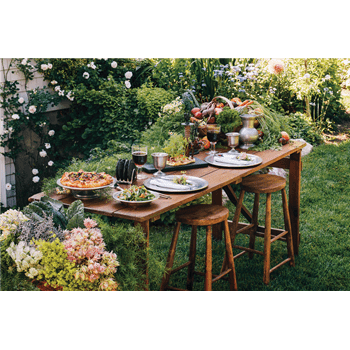 Dianne O'Connor, founder and owner of Weston Table, creates antique decors and tablescapes like this outdoor space.