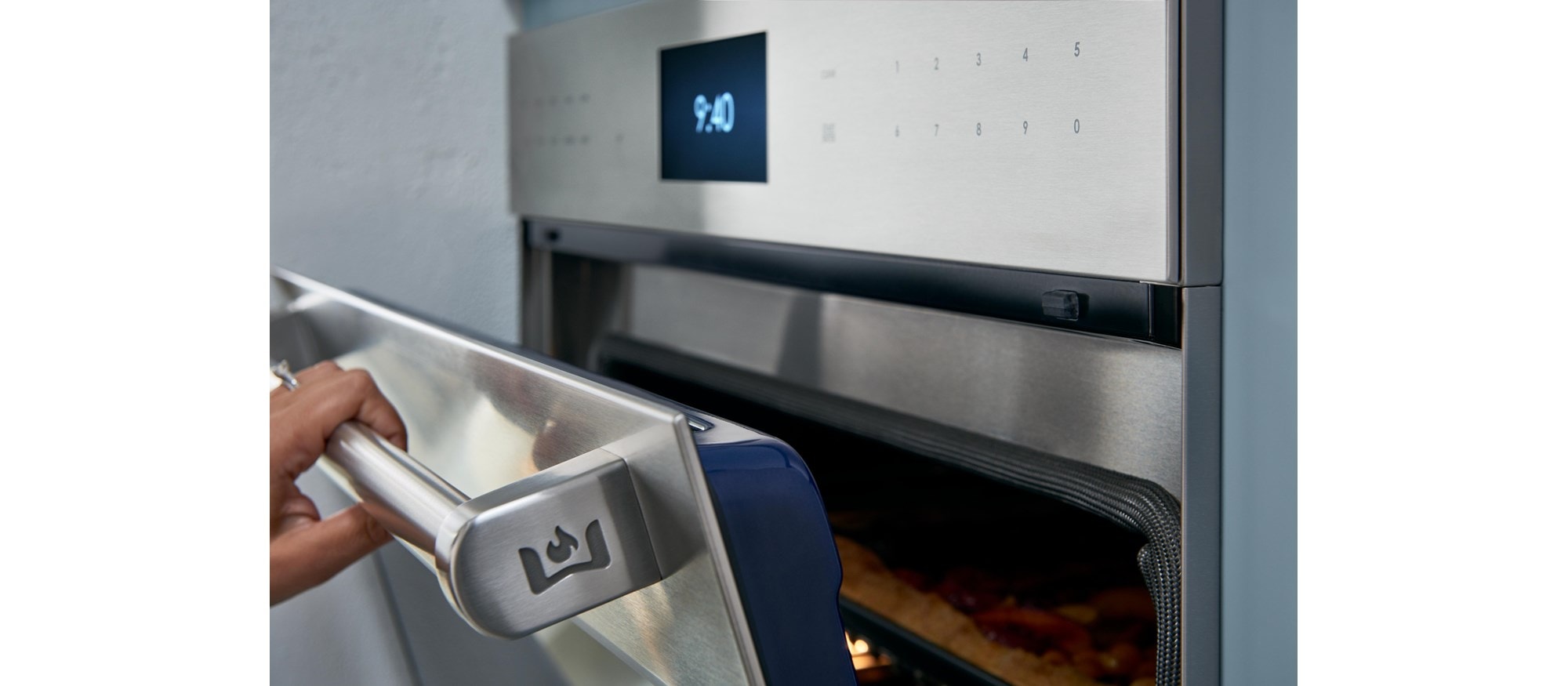 Chef product demonstration with Wolf Dual Stacked Burners at Sub-Zero, Wolf and Cove Showroom in Atlanta, Georgia