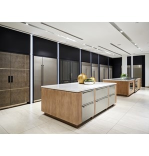 A wall of built-in Sub-Zero refrigerators in different shapes, configurations, and sizes. 