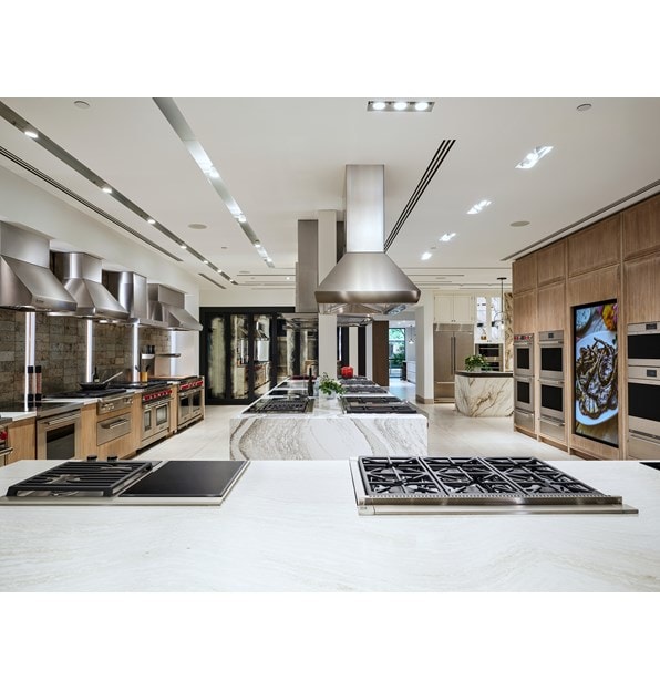 A vast assortment of different Wolf Appliances including ovens, ranges, cooktops, and ventiliation systems.
