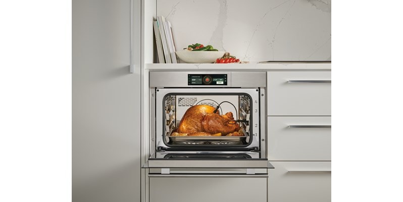 Wolf E Series Transitional Convection Steam Oven (CSOP2450TE/S/T) shown taking all of the guesswork out of cooking thanks to intelligent gourmet cooking modes.