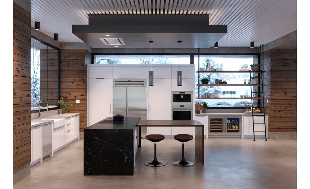 Placa de inducción contemporánea de 36" Wolf exhibida en combinación con una isla de cocina de mármol negro.