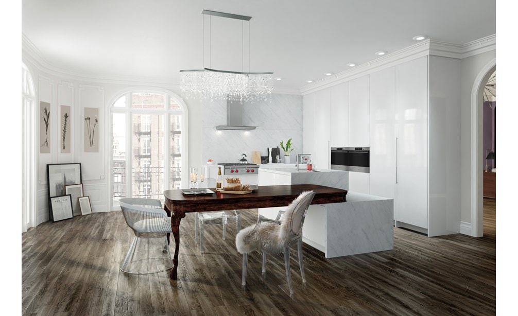 La estufa de 4 quemadores sellada de 30" Wolf (SRT304) exhibida en combinación en un espacio de cocina abierta contemporánea blanca nítida.