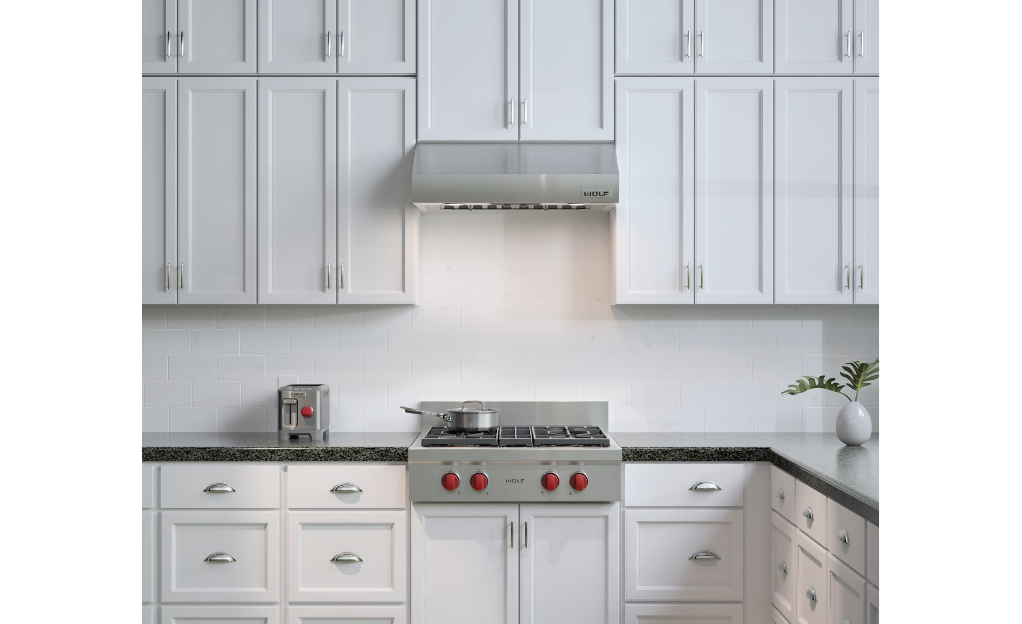 La estufa de 4 quemadores sellados de 30" Wolf (SRT304) combinada con la campana de pared de perfil bajo de 30" Wolf (PW302210)
