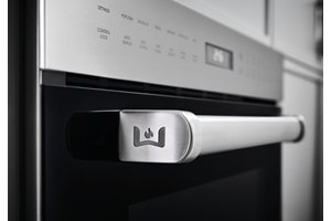 Wolf Speed Oven (SPO24TE/S/TH) shown with iconic Wolf emblem on available Pro Handle. View all Speed Ovens.