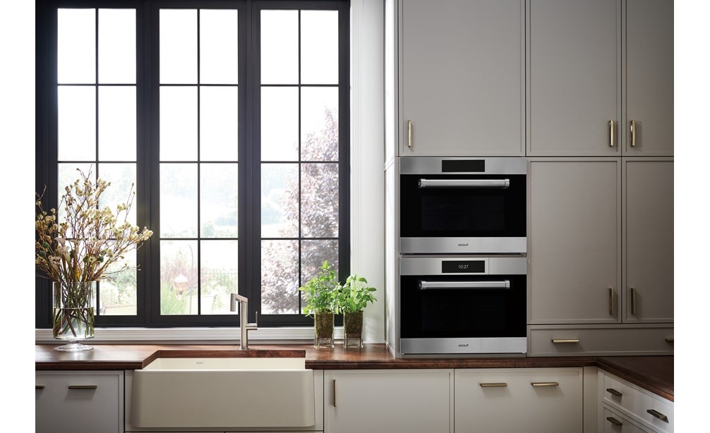 A 24 inch traditional speed oven paired with a 24 inch convection steam oven by Wolf Appliances.