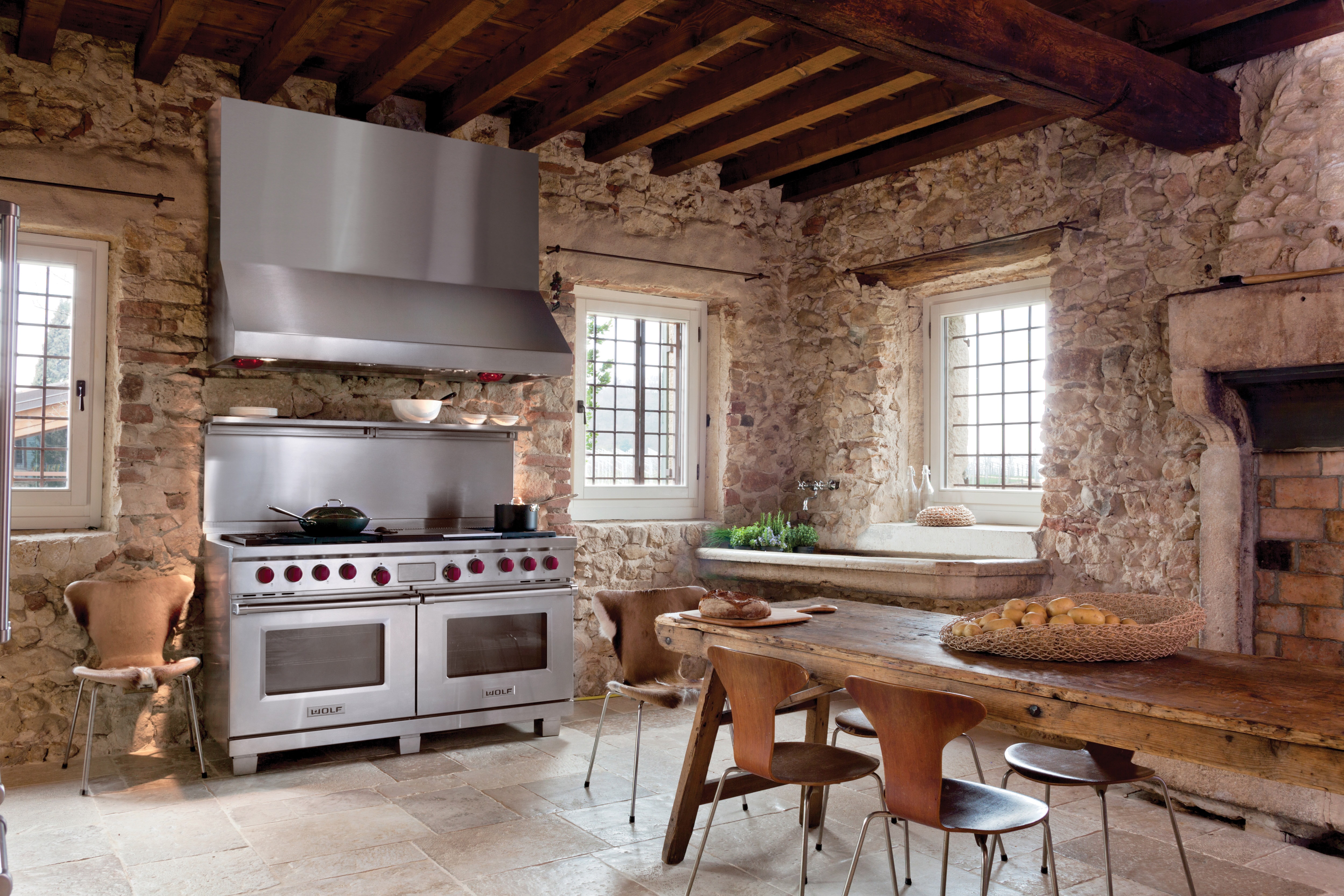 The Wolf 60" Dual Fuel Range 6 Burner Infrared Charbroiler Griddle (DF606CG) shown with Wolf 60" Pro Wall Hood - 27" Depth (PW602718)