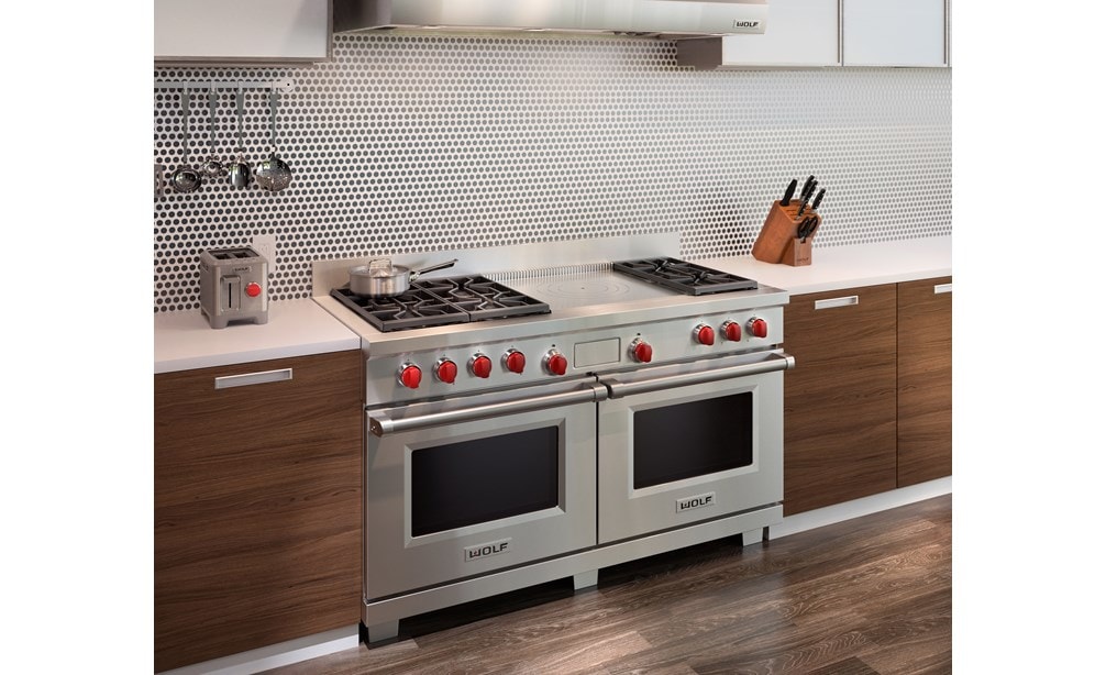 The Wolf 60" Dual Fuel Range 6 Burner French Top (DF606F) shown with Wolf Two-Slice-Toaster with Red Knob (WGTR102S)