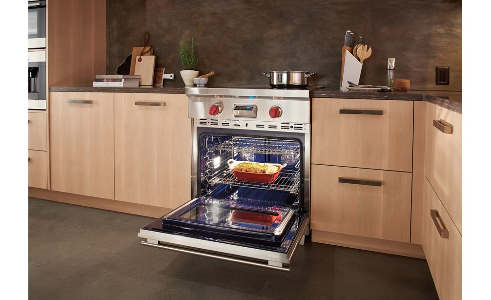 Wolf 30" Transitional Induction Range (IR304TE/S/TH) showing multiple oven racks working in concert thanks to dual fans, each with its own heating element