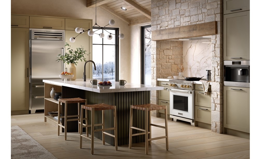 Wolf 30 Inch Professional Induction Range featuring white accent oven door with brushed brass knobs shown in a Nordic chalet kitchen design.