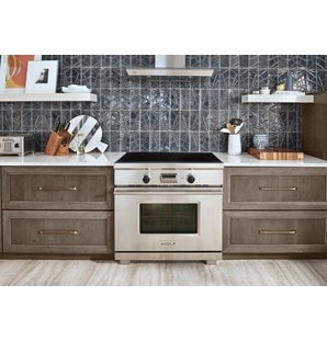 The Wolf 36" Transitional Induction Range (IR365TE/S/TH) featured with Wolf 36" Cooktop Wall Hood - Glass (VW36G)