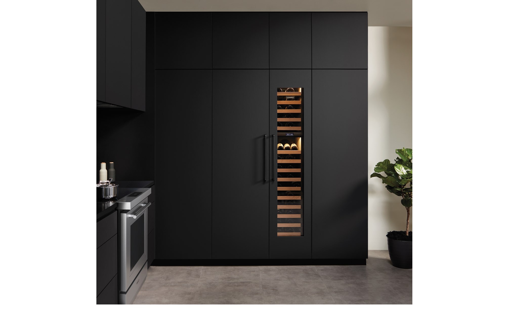 Sub-Zero Designer Series Refrigerator integrated into kitchen with black matte custom cabinetry