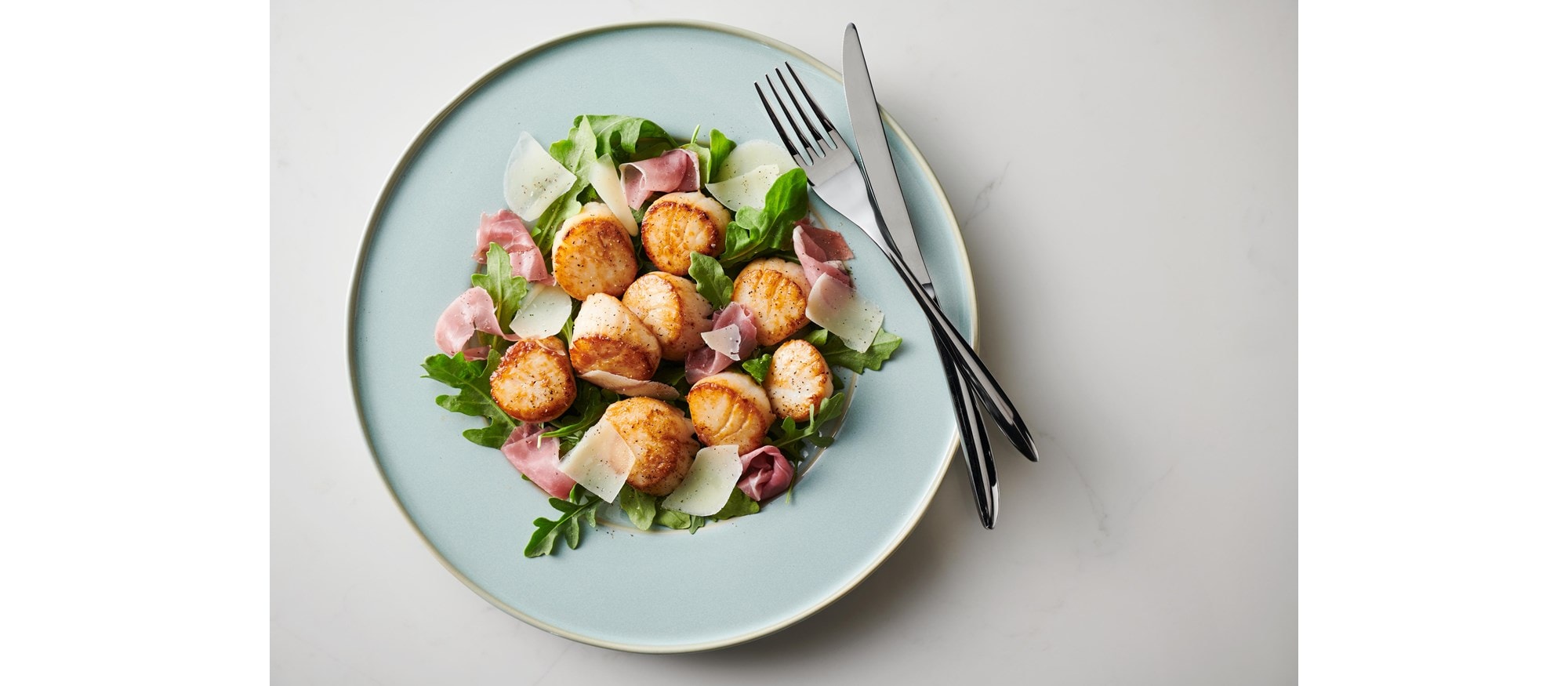 Fácil y deliciosa receta de vieiras con la configuración del modo Griddle (plancha) de su estufa dual Wolf