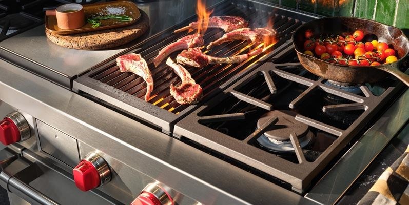Wolf 48&quot; Dual Fuel Range 4 Burner Infrared Charbroil Griddle (DF48450CG/S/P) shown in action searing meat and sauteing vegetables with finesse.
