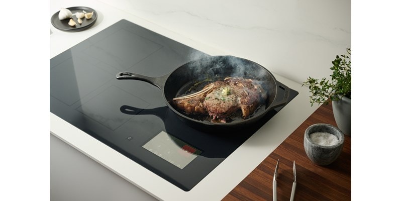 Searing steak on 30-inch Induction Cooktop in cast iron skillet