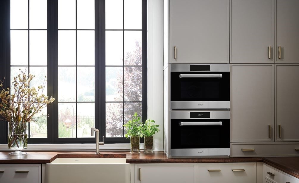 A 24 inch traditional speed oven paired with a 24 inch convection steam oven by Wolf Appliances.