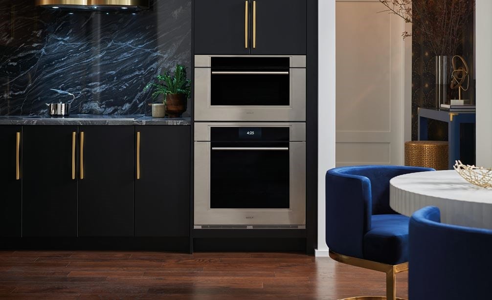 The Wolf 30" M Series Transitional Speed Oven - SPO3050TM/S/T in a modern black high rise