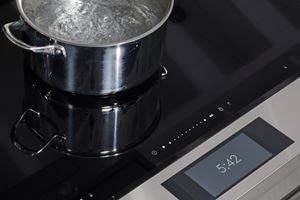 Wolf 36" Induction Range (IR36550/S/T) shown with Boost Mode in action offering quick boil heat zone.